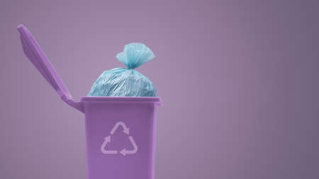 Garbage bag in a trash bin, waste management and recycling concept