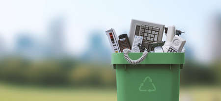 Waste bin full of electronics, e-waste and recycling conceptの写真素材