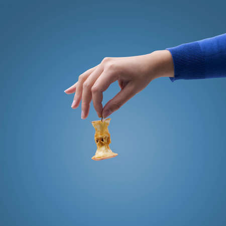 Hand holding organic waste, separate waste collection and recycling conceptの写真素材