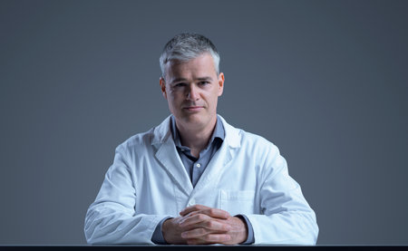 Confident medical scientist posing and looking at cameraの写真素材