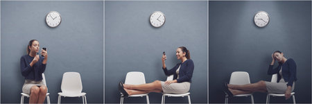 Young businesswoman waiting for hours in the waiting room, her job interview is delayed and she...