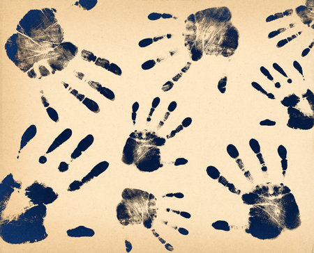 Black hand prints on vintage paper, togetherness and identity conceptの写真素材