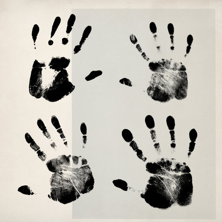 Black hand prints on vintage paper, togetherness and identity conceptの写真素材