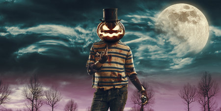 Creepy horror Halloween pumpkin head monster smiling surrounded by fog, copy spaceの写真素材