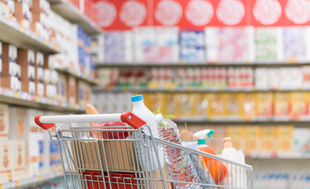 Trolley full of fresh groceries at the supermarket, grocery shopping conceptの写真素材