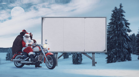 Unconventional Santa riding a motorcycle and blank advertising board, Christmas advertising campaign conceptの写真素材