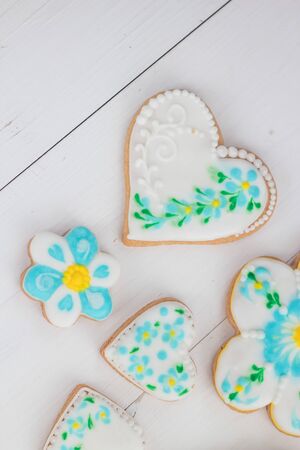 Homemade cookies made in the form of heart with multi-colored glaze.の写真素材