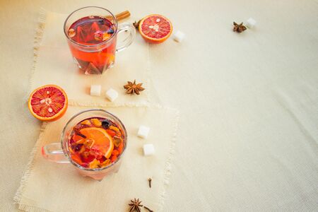 Tea made from dried fruit, seasoned with cinnamon cloves and anise seeds. There is an orange nearbyの写真素材