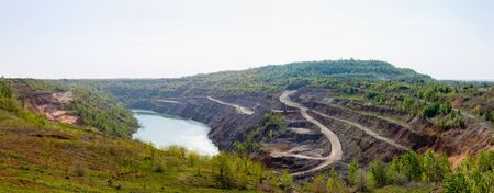 To get a stone. Large quarry flooded with water.の写真素材