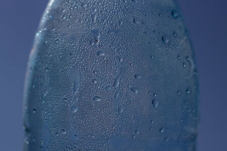 Drops flow down the wall of a water bottle. Drinking Water Bottleの写真素材