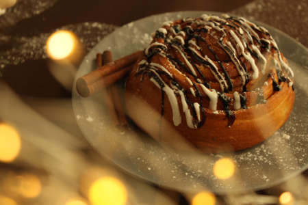A spiral bun on a plate with garlands.の写真素材