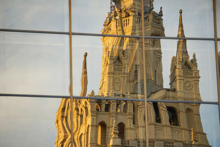 A large historic building is reflected and distorted in mirrorsの写真素材
