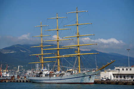 A beautiful frigate with masts stands in the port city of Novorossiysk.の写真素材