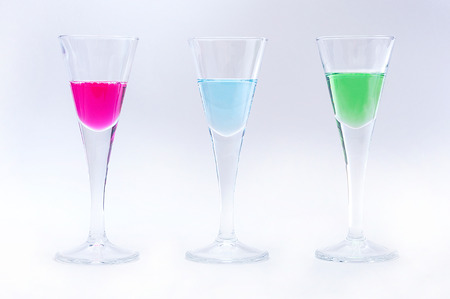 Thre, small glasses with liquids  pink, green and blue の写真素材