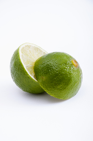 One piece of lime, cuted in the medium, laying one on other の写真素材