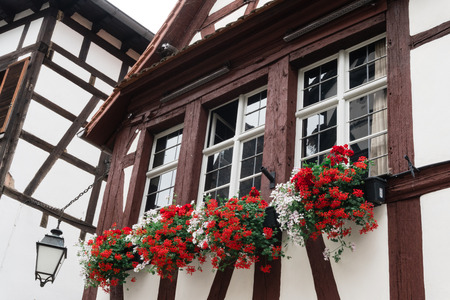 Typical window with flower of an old house in Strasbourgの写真素材