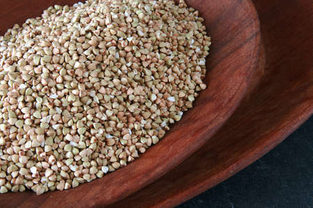 Wooden bowl full of salted peanutsの写真素材