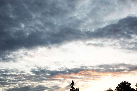 Cloudscape, Colored Clouds at Sunset near the Ocean in the Skyの写真素材