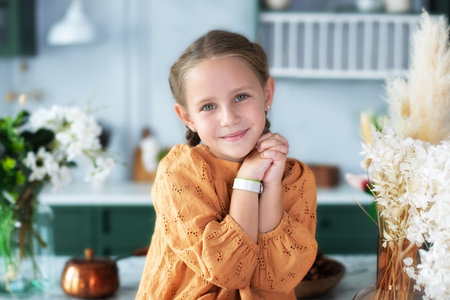 Portrait of a cheerful smiling little cute girl. The child is beautiful girl with wide eyes looking at the camera. Expressive face emotions. Joy, positive emotions and happy childの写真素材
