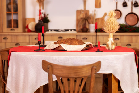 Festive table setting for christmas dinner in the rustic kitchen