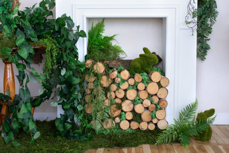 Decorated fireplace with green plants and a rabbit in the interior
