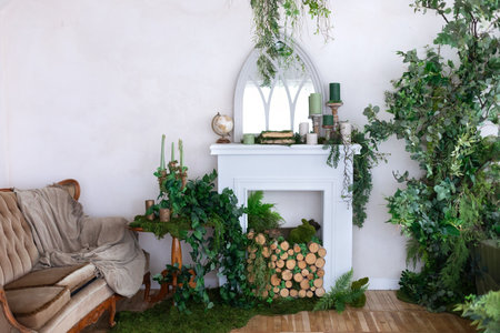 Interior of the living room decorated with green plants and fireplace.の写真素材