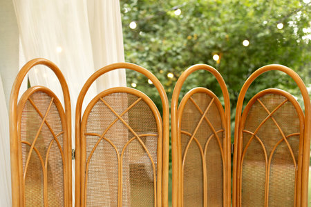 Wicker chairs in the garden on the terrace, closeup