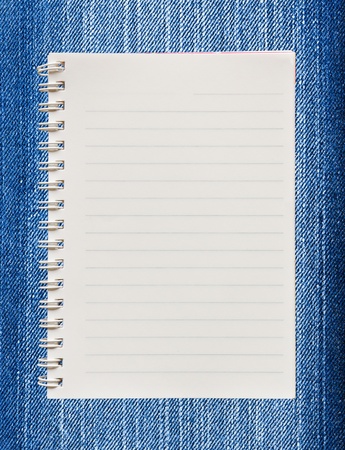 Blank paper with on  blue jeans backgroundの写真素材