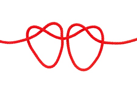 Heart shape from red rope isolated on whiteの写真素材