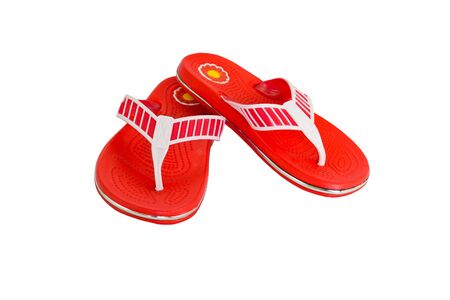 Orange flip-flops on a white backgroundの写真素材