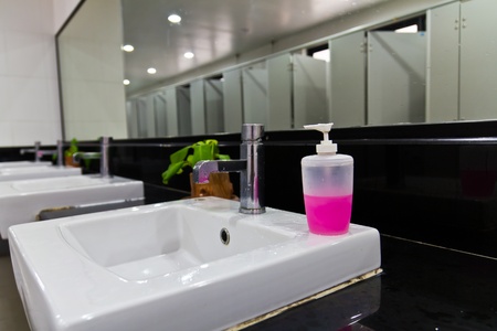 Row of faucet and bowlsの写真素材