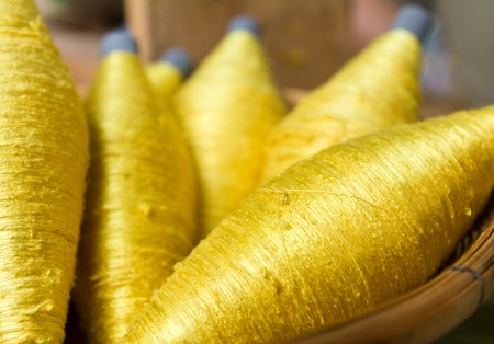 Sewing threads golden color  closeupの写真素材