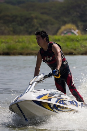 SARABURI THAILAND-JANUARY 20: Sonswut Rappasubpisan in action during show Freestyle the Jet ski  stunt action  on Jan 20, 2013 in SARABURI,Thailand.のeditorial素材