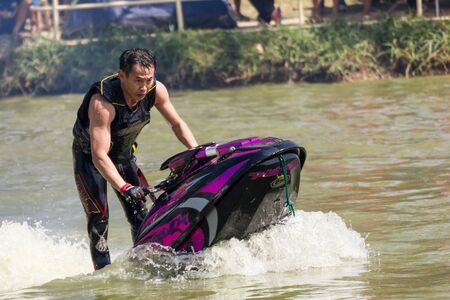 SARABURI THAILAND-JANUARY 20: Somchai Sae-Tang in action during show Freestyle the Jet ski  stunt action  on Jan 20, 2013 in SARABURI,Thailand.のeditorial素材