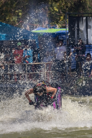 SARABURI THAILAND-JANUARY 20: Somchai Sae-Tang in action during show Freestyle the Jet ski  stunt action  on Jan 20, 2013 in SARABURI,Thailand.のeditorial素材