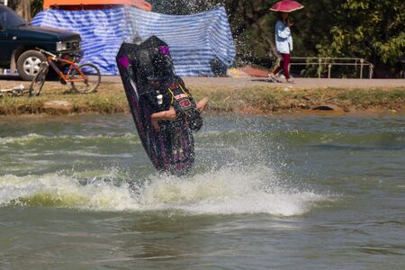 SARABURI THAILAND-JANUARY 20: Somchai Sae-Tang in action during show Freestyle the Jet ski  stunt action  on Jan 20, 2013 in SARABURI,Thailand.のeditorial素材
