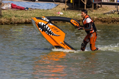 SARABURI THAILAND-JANUARY 20: Boonlue Korbangyang in action during show Freestyle the Jet ski  stunt action  on Jan 20, 2013 in SARABURI,Thailand.のeditorial素材