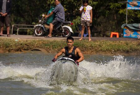 SARABURI THAILAND-JANUARY 20: Veerapong Maneechom in action during show Freestyle the Jet ski  stunt action  on Jan 20, 2013 in SARABURI,Thailand.のeditorial素材