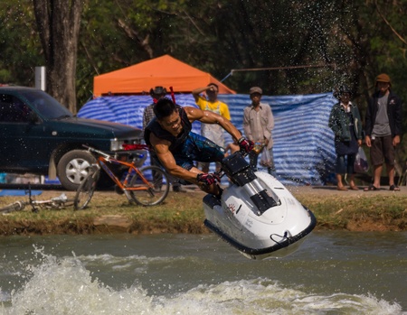 SARABURI THAILAND-JANUARY 20: Veerapong Maneechom in action during show Freestyle the Jet ski  stunt action  on Jan 20, 2013 in SARABURI,Thailand.のeditorial素材