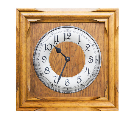 Old antique wall clock is handmade woodcraft on white