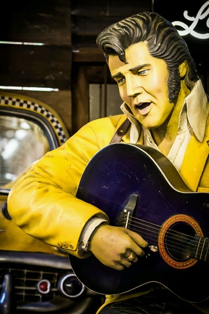 Elvis Presley model singing in pub