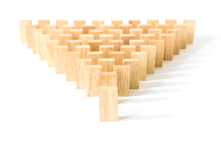 Row wooden domino against the white background