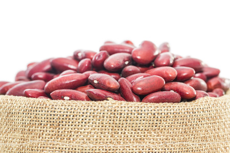 Close up dried kidney  beans in Sacks fodder on white background