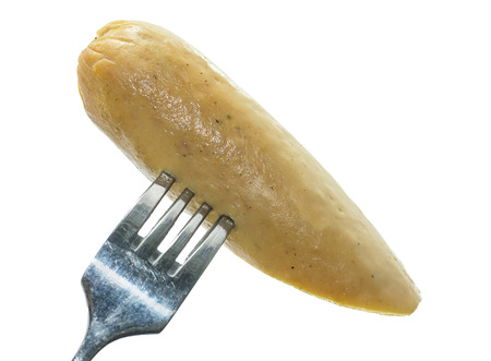 Closeup sausage on a fork isolated on white background