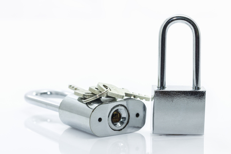 Metallic padlock with  keys on white backgroundの写真素材