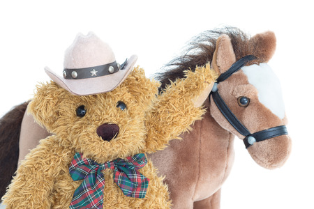 Cowboy Teddy bear and horses on white backgroundの写真素材