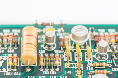 Closeup electronic hardware . Resistor and condensers assembly on the circuit board