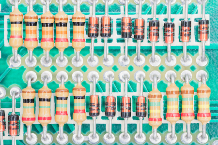 Closeup electronic hardware .Resistor and condensers assembly on the circuit boardの写真素材