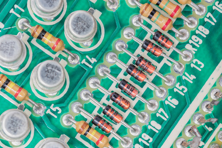 Closeup electronic hardware .Resistor and condensers assembly on the circuit board