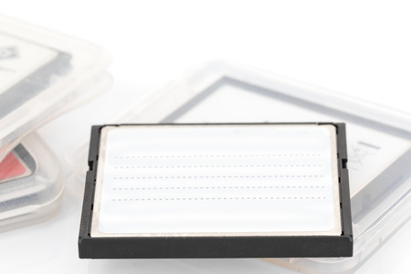 Compact Flash memory cards (CF card) and case on white background